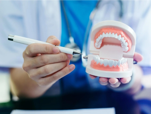 Doctor Pointing Teeth